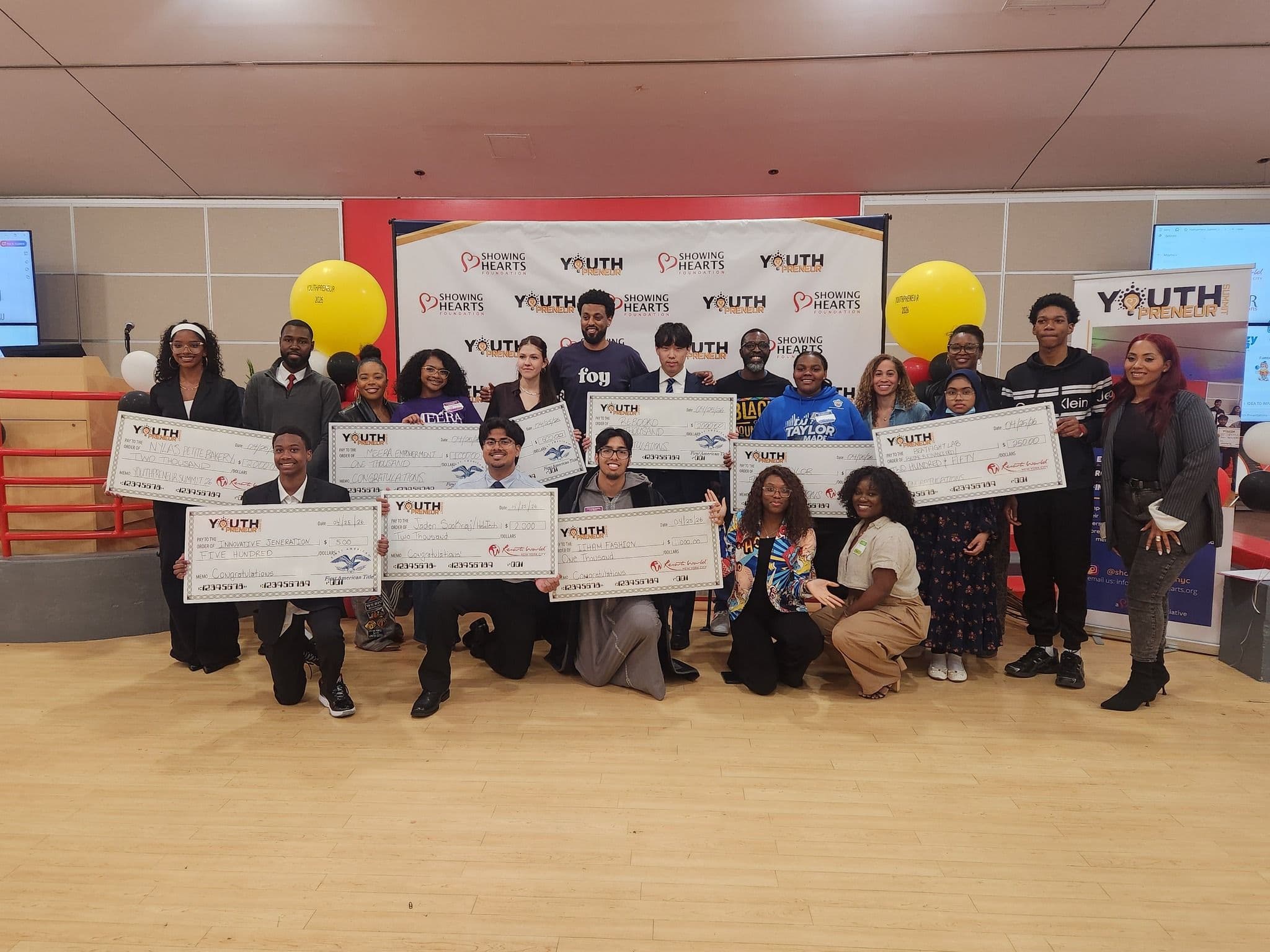 Youthpreneur Summit pitch competition winners holding their prize checks